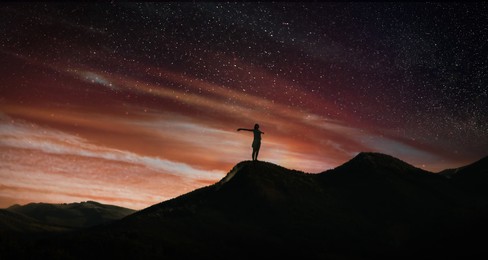Image of Silhouette of woman in mountains under starry sky, banner design