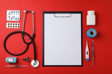 Flat lay composition with medical objects on color background. Space for text