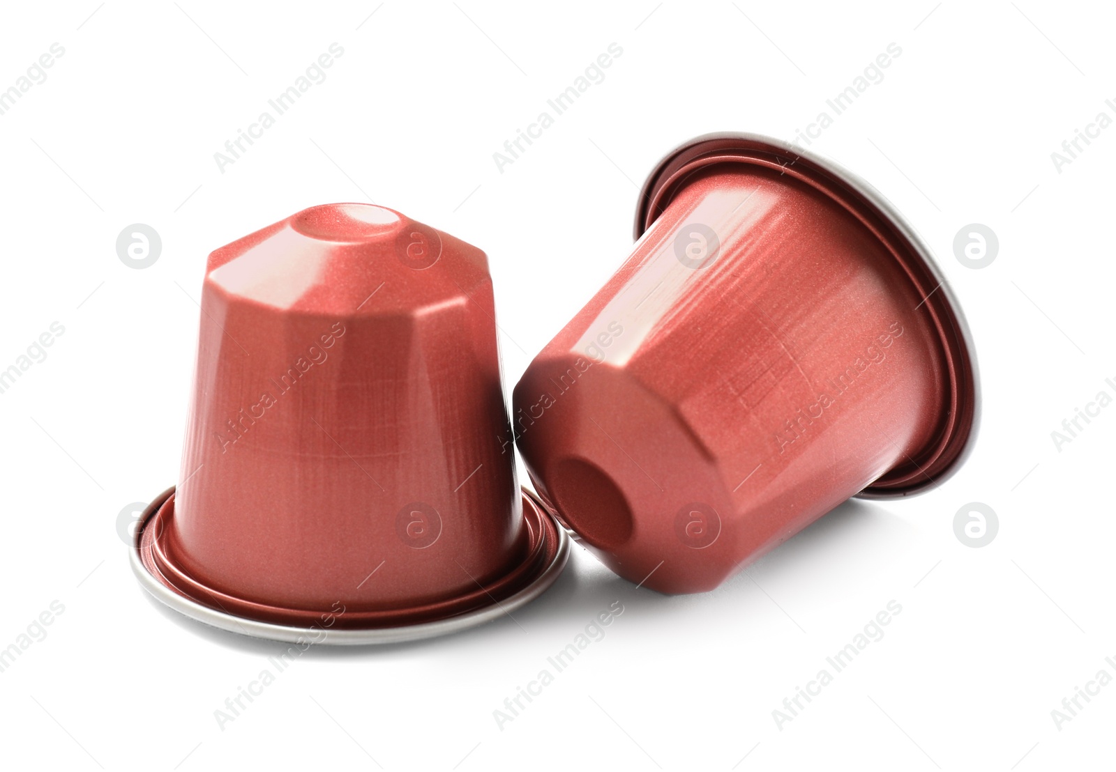 Photo of Two plastic coffee capsules isolated on white