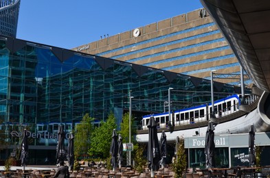 Hague, Netherlands - May 2, 2022: Central railway station near modern buildings in city