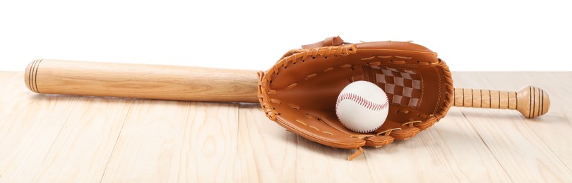 Photo of Baseball bat, ball and catcher's mitt on wooden table against white background