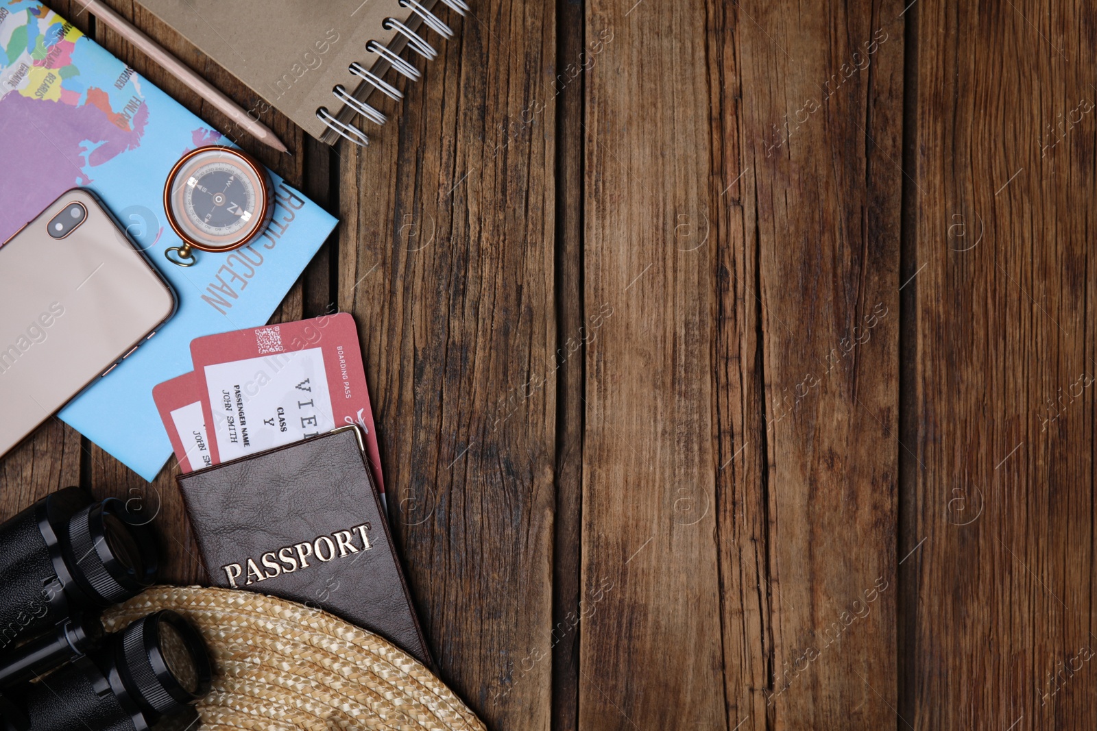 Photo of Flat lay composition with passport and tickets on wooden table. Space for text