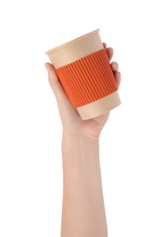 Woman holding takeaway paper coffee cup with cardboard sleeve on white background, closeup