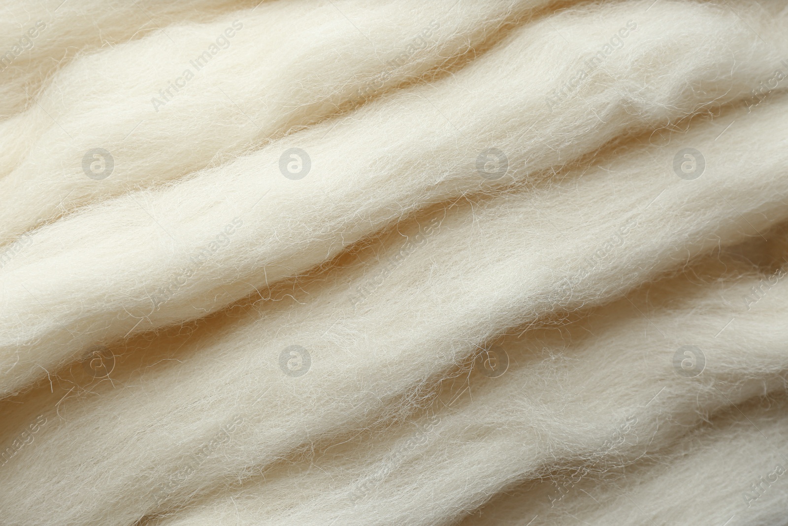 Photo of Soft white wool texture as background, closeup