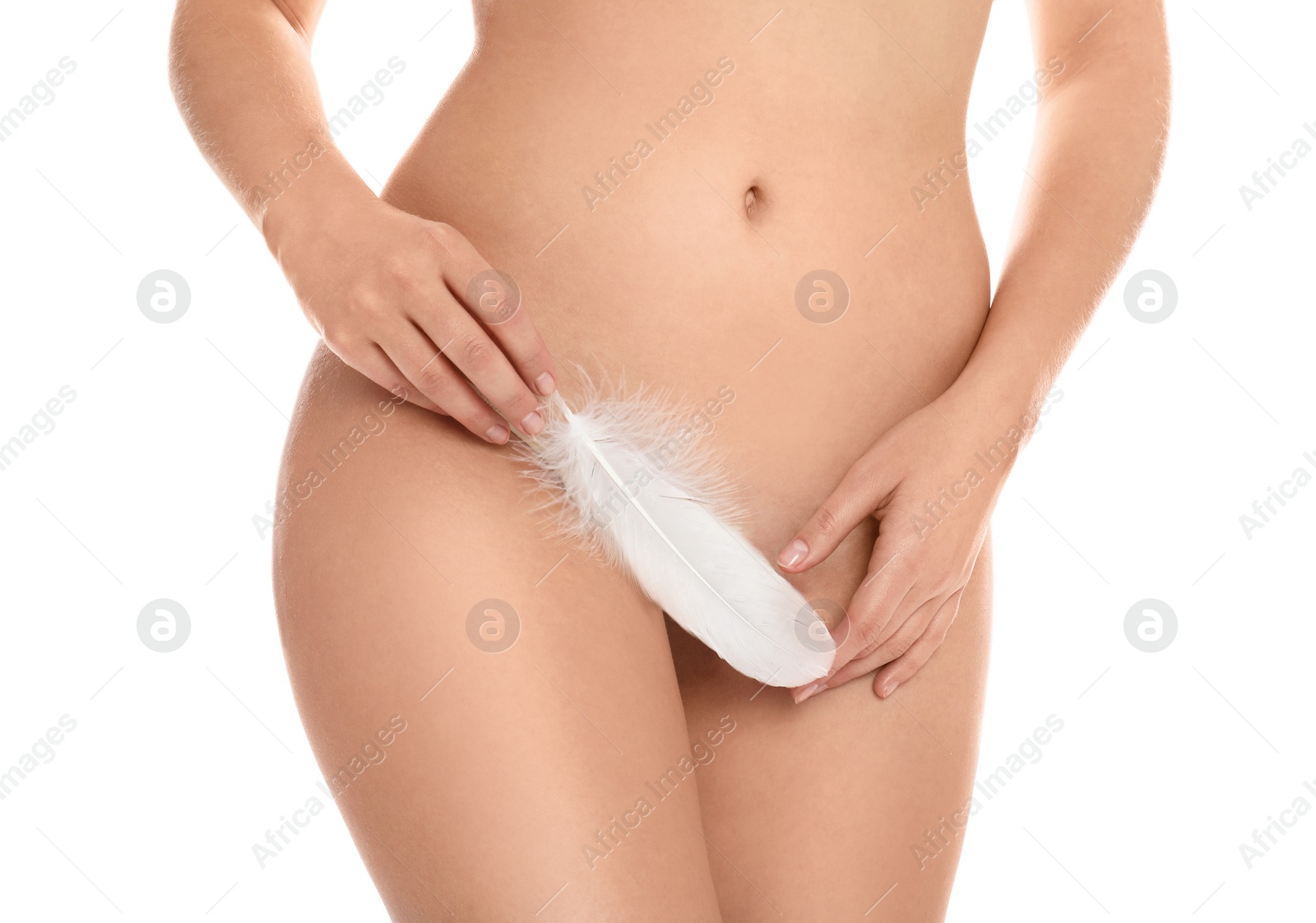 Photo of Woman with feather showing smooth skin on white background, closeup. Brazilian bikini epilation