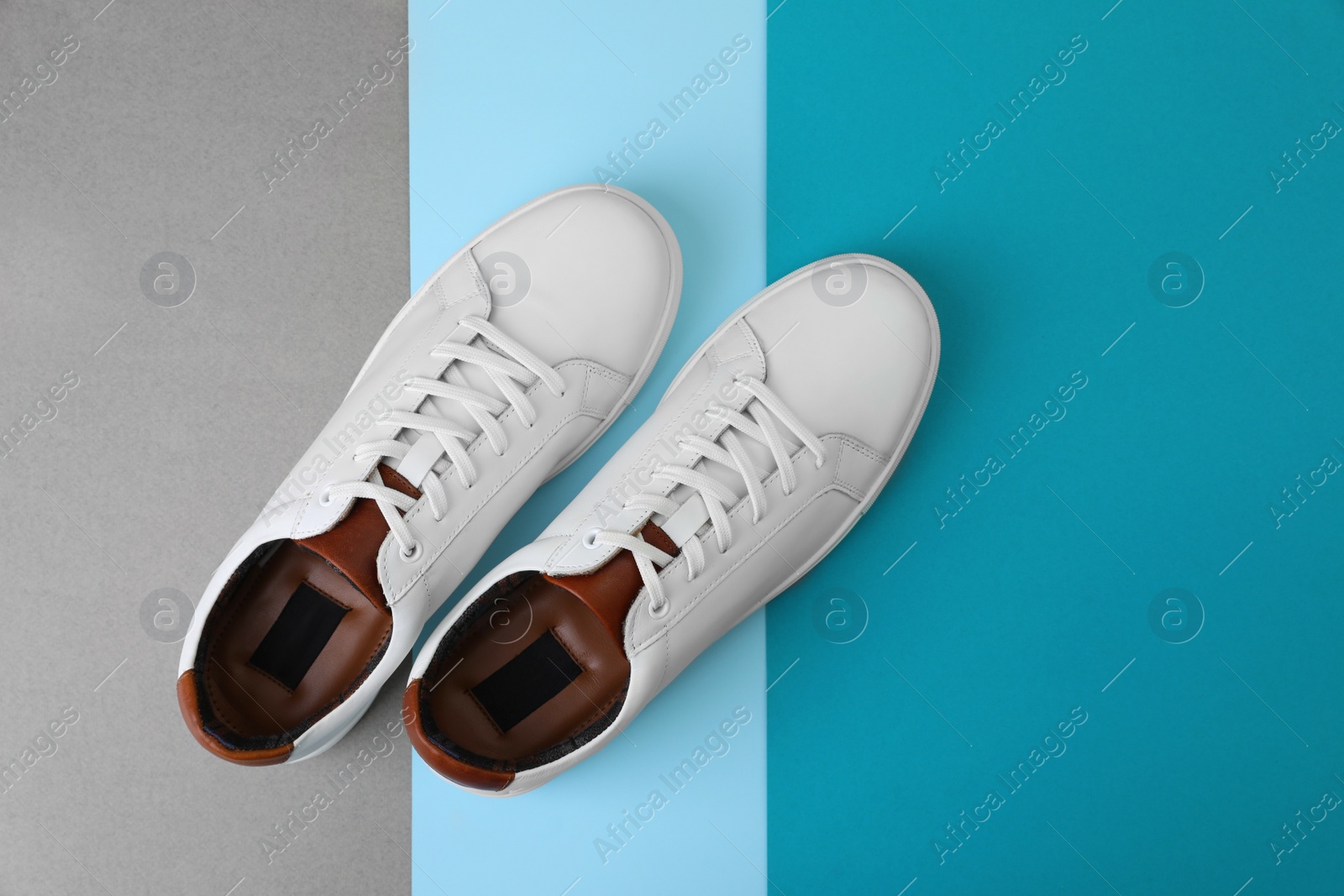 Photo of Pair of stylish sports shoes on color background, flat lay. Space for text