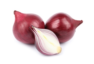 Fresh whole and cut red onions on white background