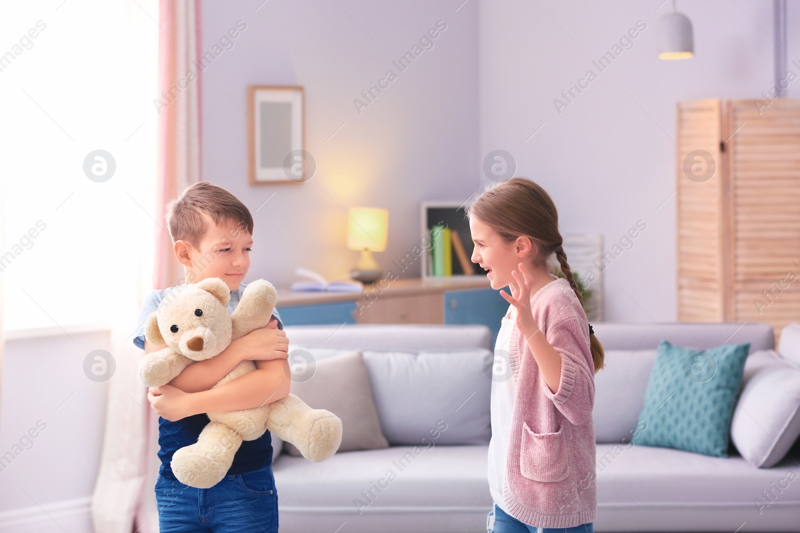 Photo of Brother arguing with sister at home