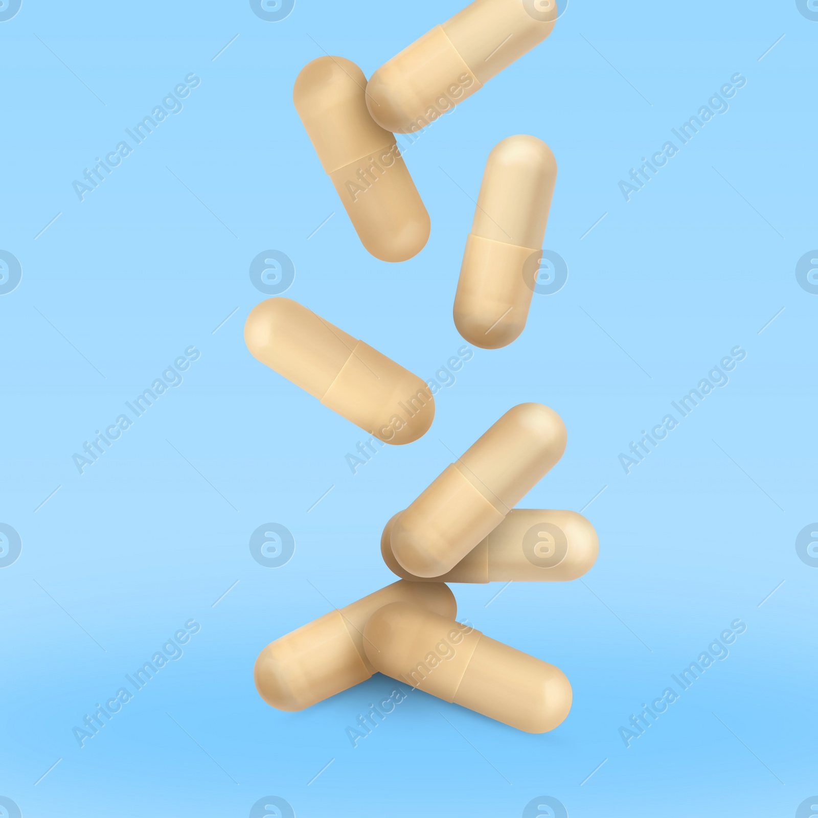 Image of Vitamin. Capsules falling on light blue gradient background