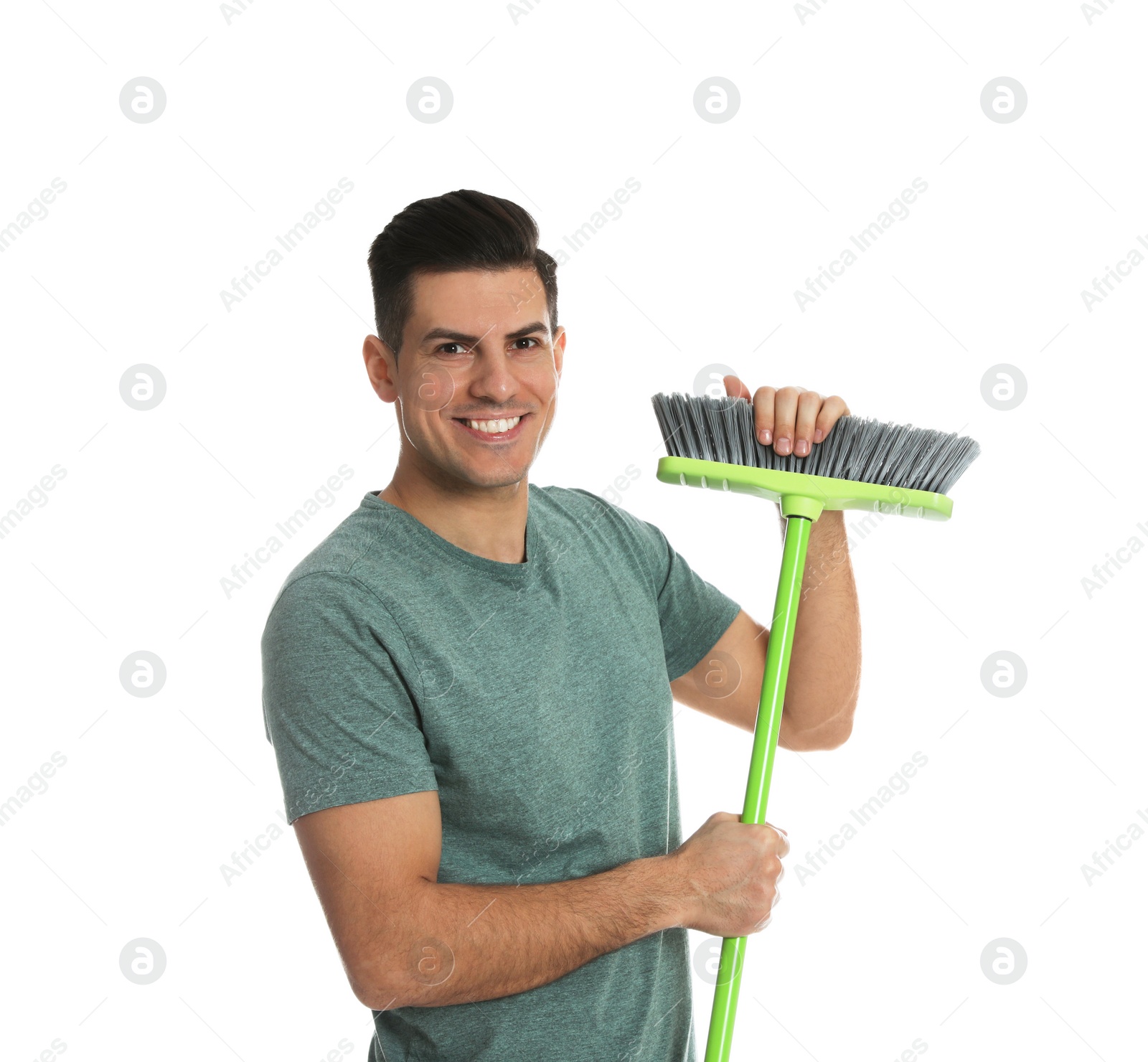 Photo of Man with green broom on white background