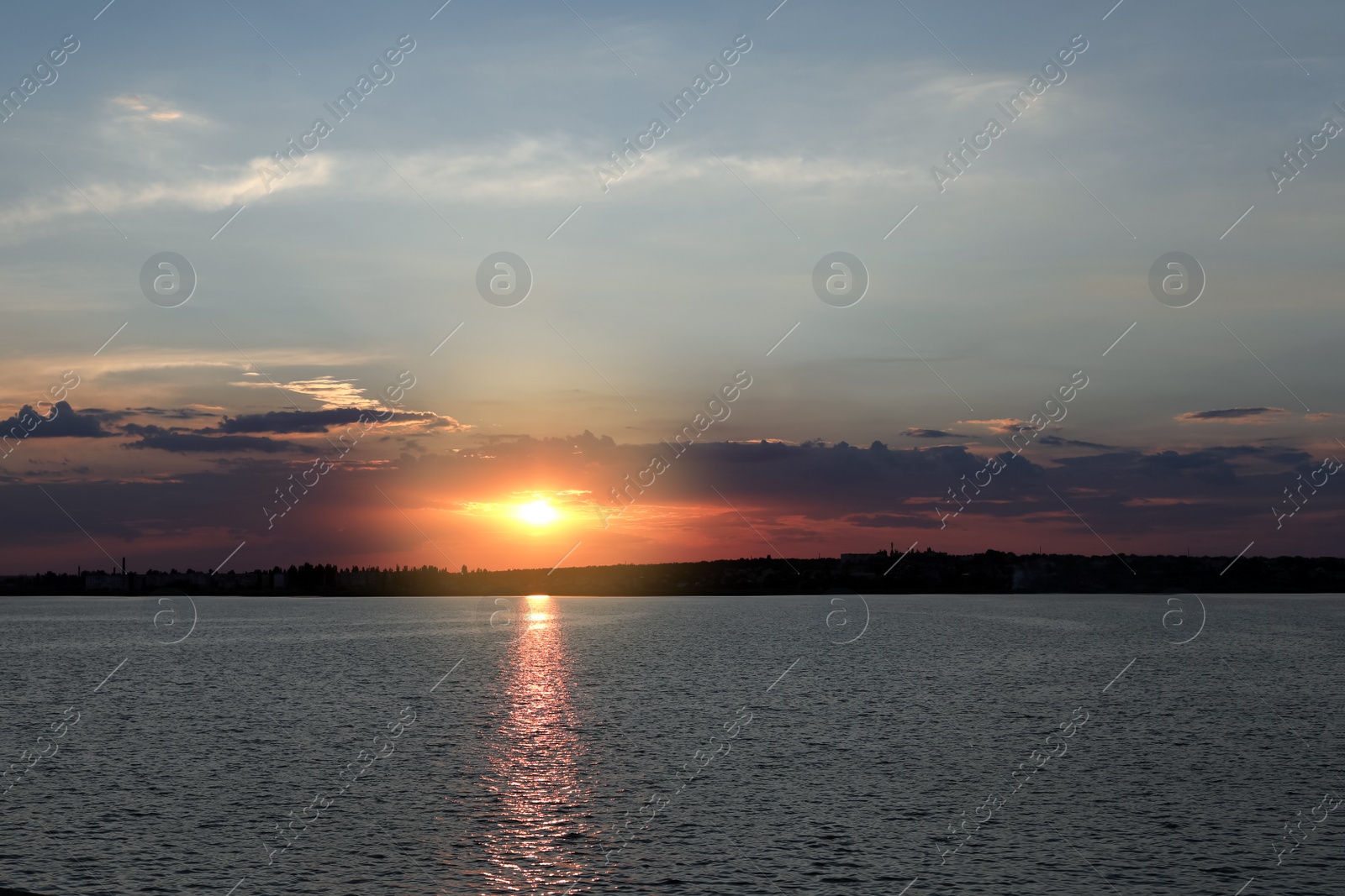 Photo of Picturesque view of beautiful sunrise on riverside. Morning sky