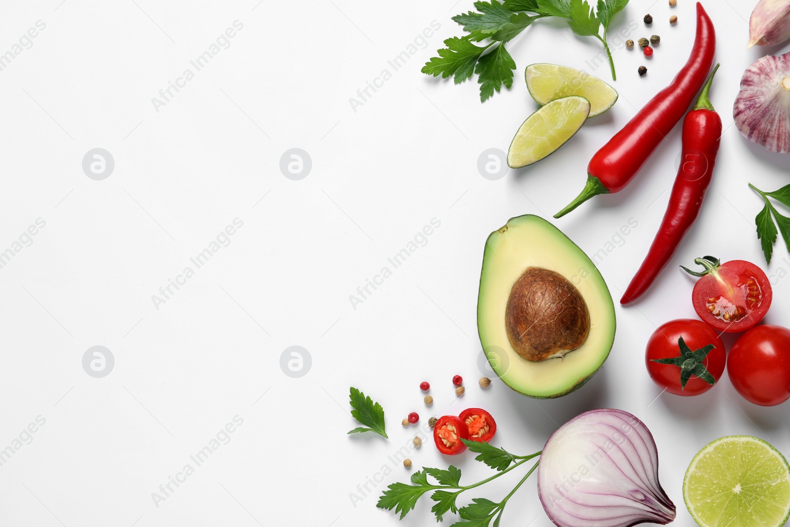 Photo of Fresh guacamole ingredients on white background, flat lay. Space for text