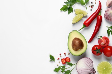 Fresh guacamole ingredients on white background, flat lay. Space for text