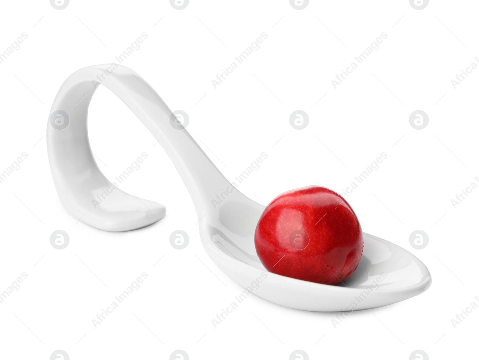 Photo of Spoon with sweet red cherry on white background