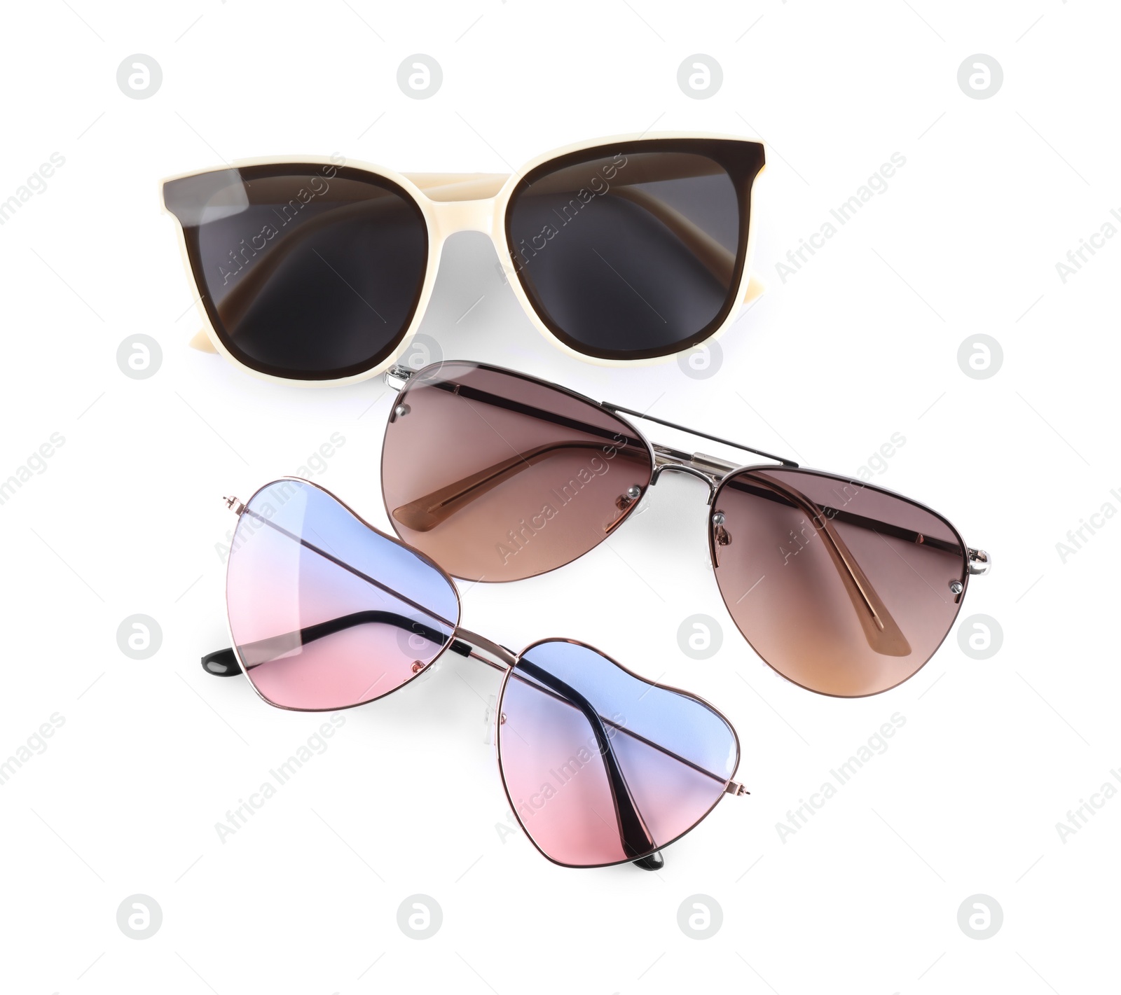 Photo of Different stylish sunglasses on white background. Sun protection