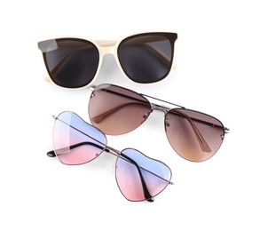 Different stylish sunglasses on white background. Sun protection