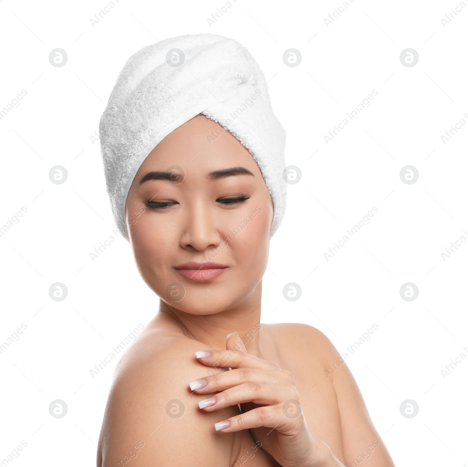 Photo of Portrait of beautiful Asian woman with towel on head against white background. Spa treatment