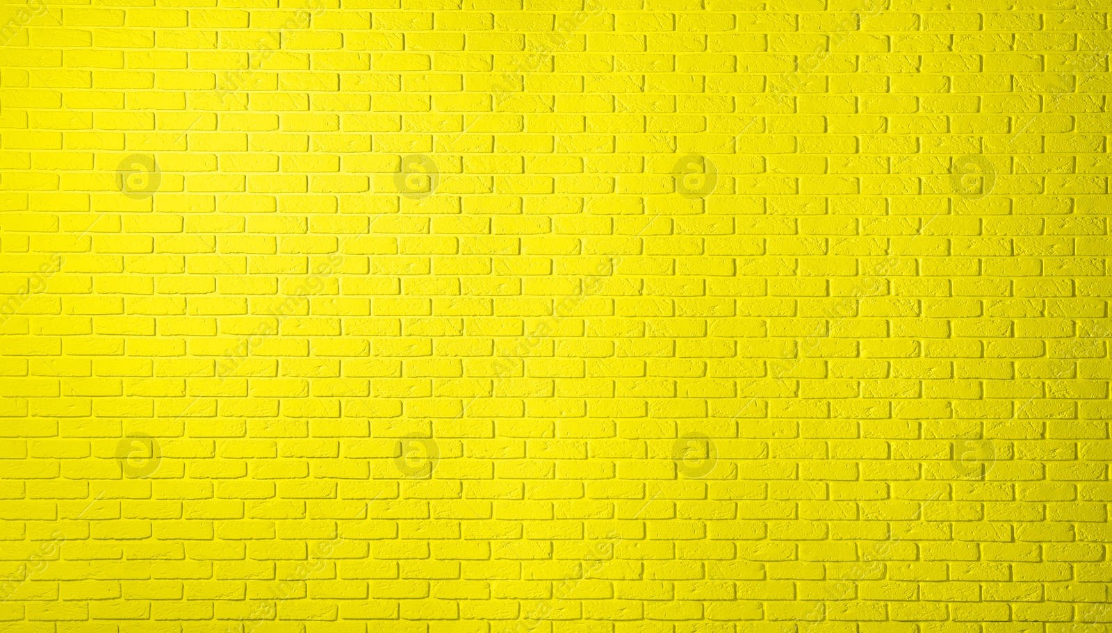 Image of Texture of yellow color brick wall as background