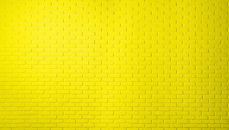 Image of Texture of yellow color brick wall as background