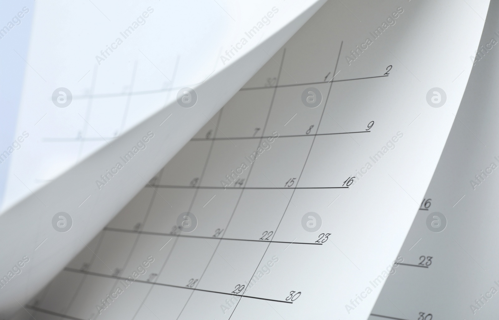 Photo of Closeup view of white paper office calendar