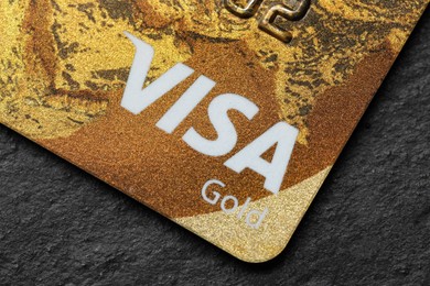 Photo of MYKOLAIV, UKRAINE - FEBRUARY 22, 2022: Visa credit card on black background, closeup