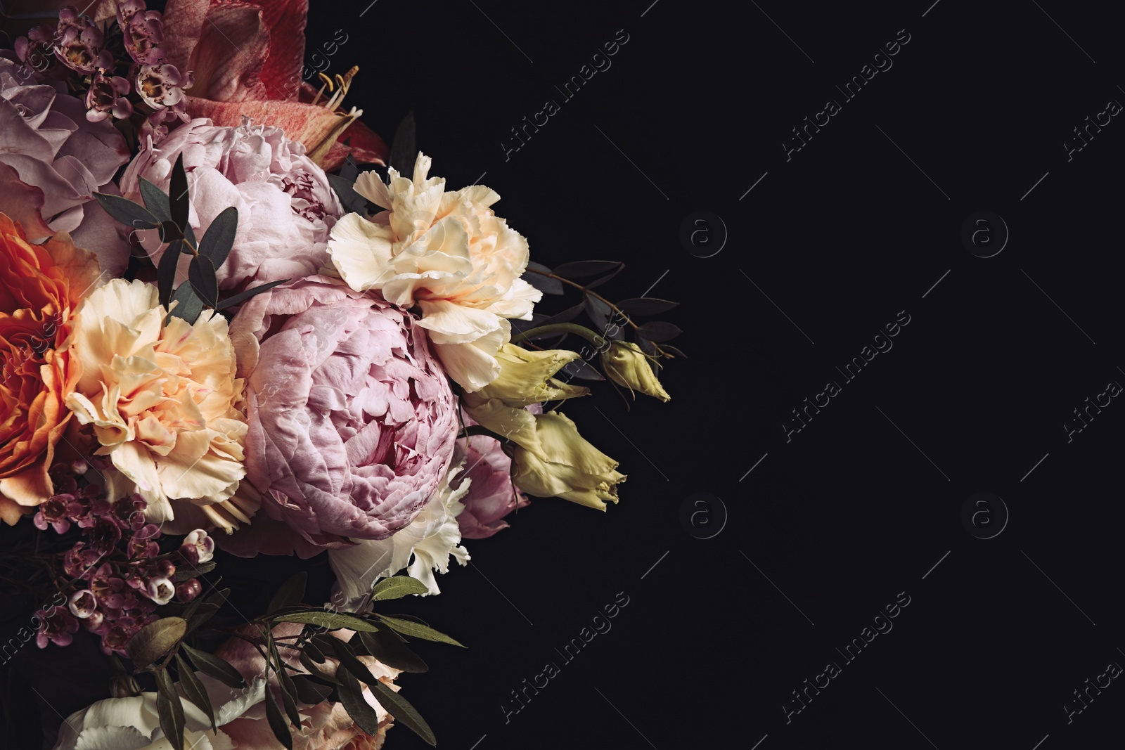 Photo of Beautiful bouquet of different flowers on black background, space for text. Floral card design with dark vintage effect