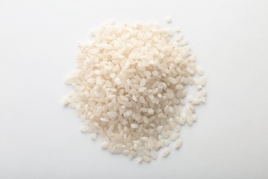 Photo of Raw rice on white background. Healthy grains and cereals