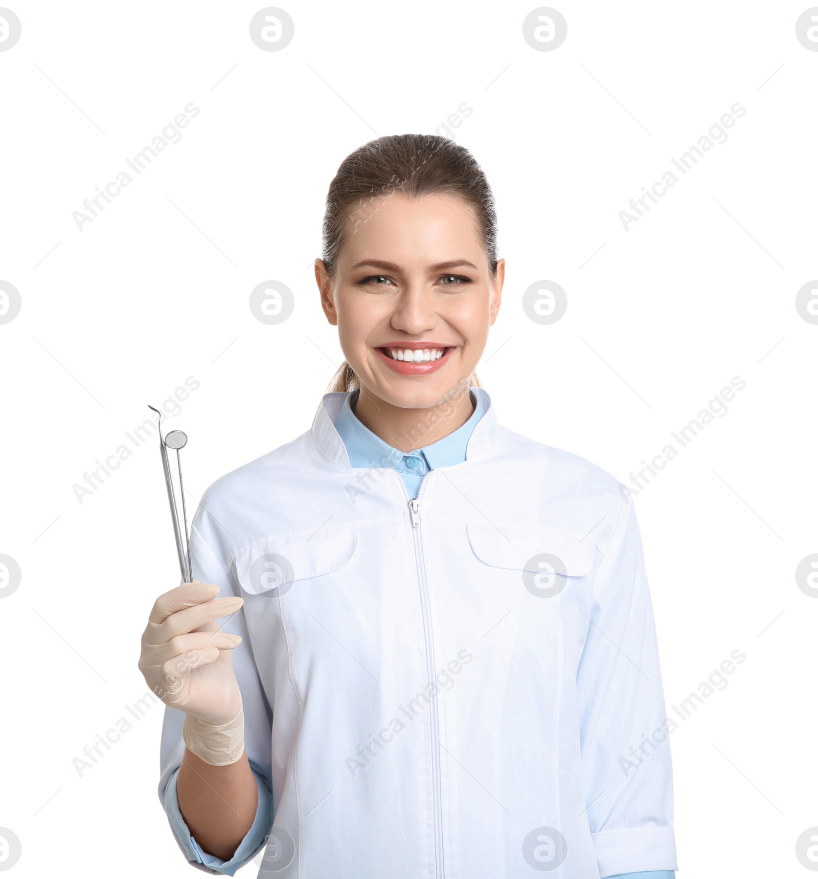 Photo of Female dentist holding professional tools on white background