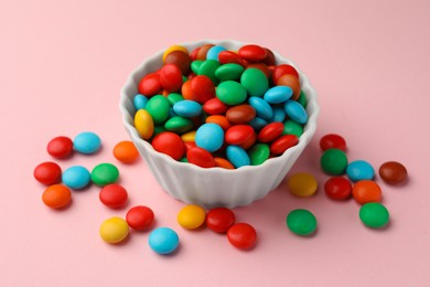 Photo of Tasty colorful candies on pink background, closeup