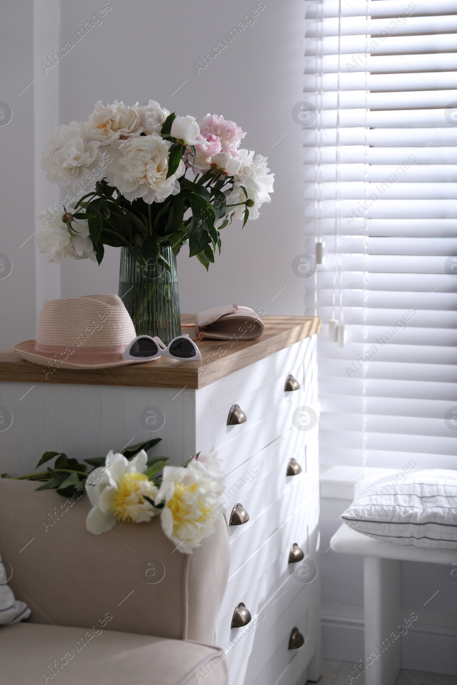 Photo of Bouquet of beautiful peony flowers in room