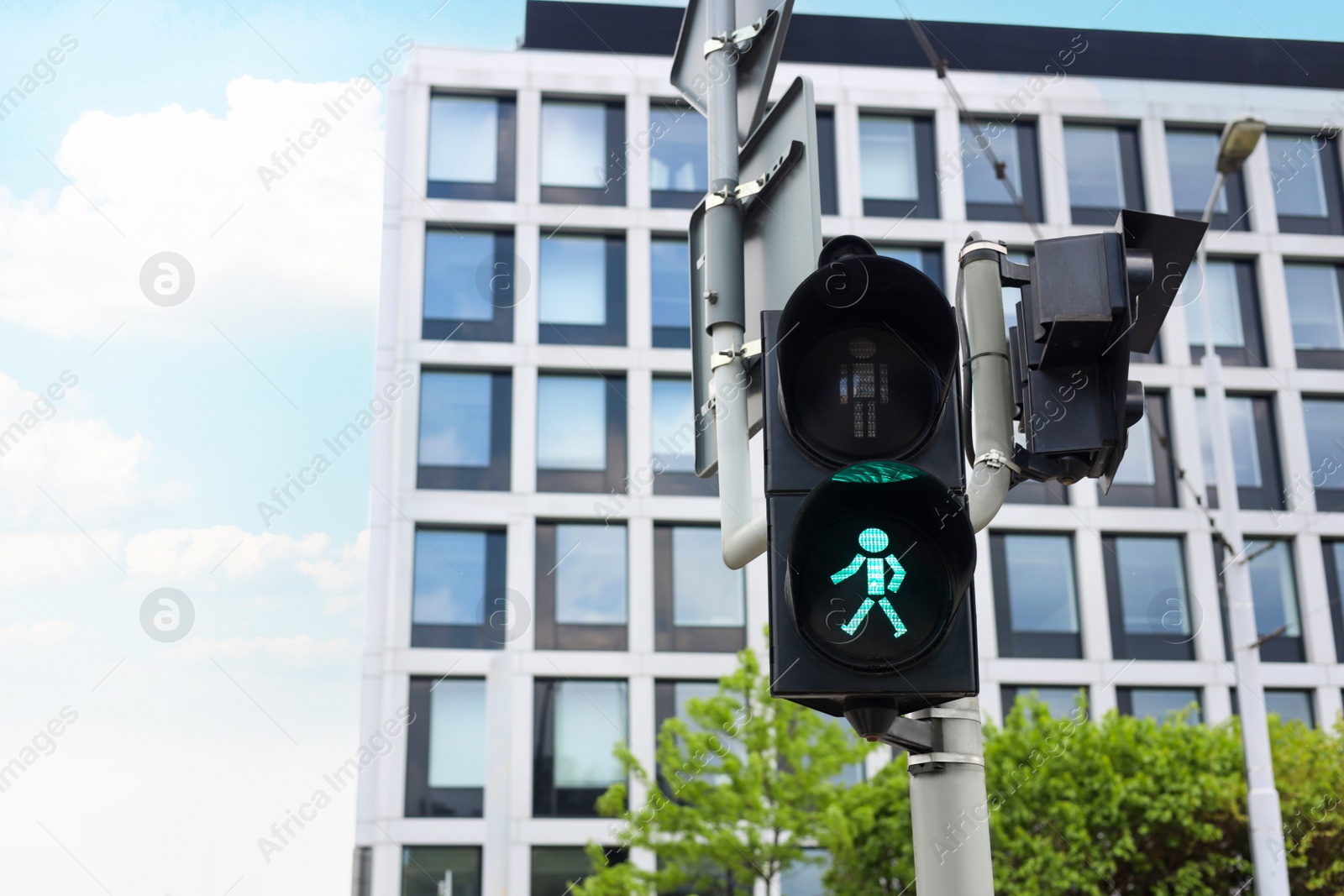 Photo of Traffic light on city street, space for text