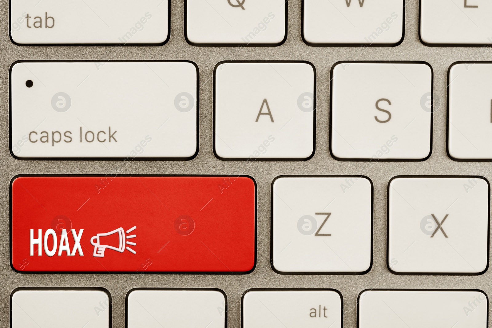 Image of Red button with word Hoax and loudspeaker on computer keyboard, top view