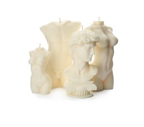 Photo of Collection of beautiful sculptural candles on white background