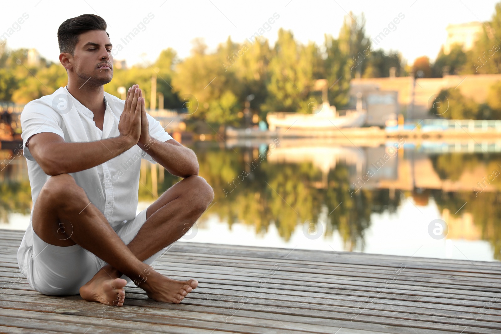 Photo of Man near river at sunset, space for text. Nature healing power