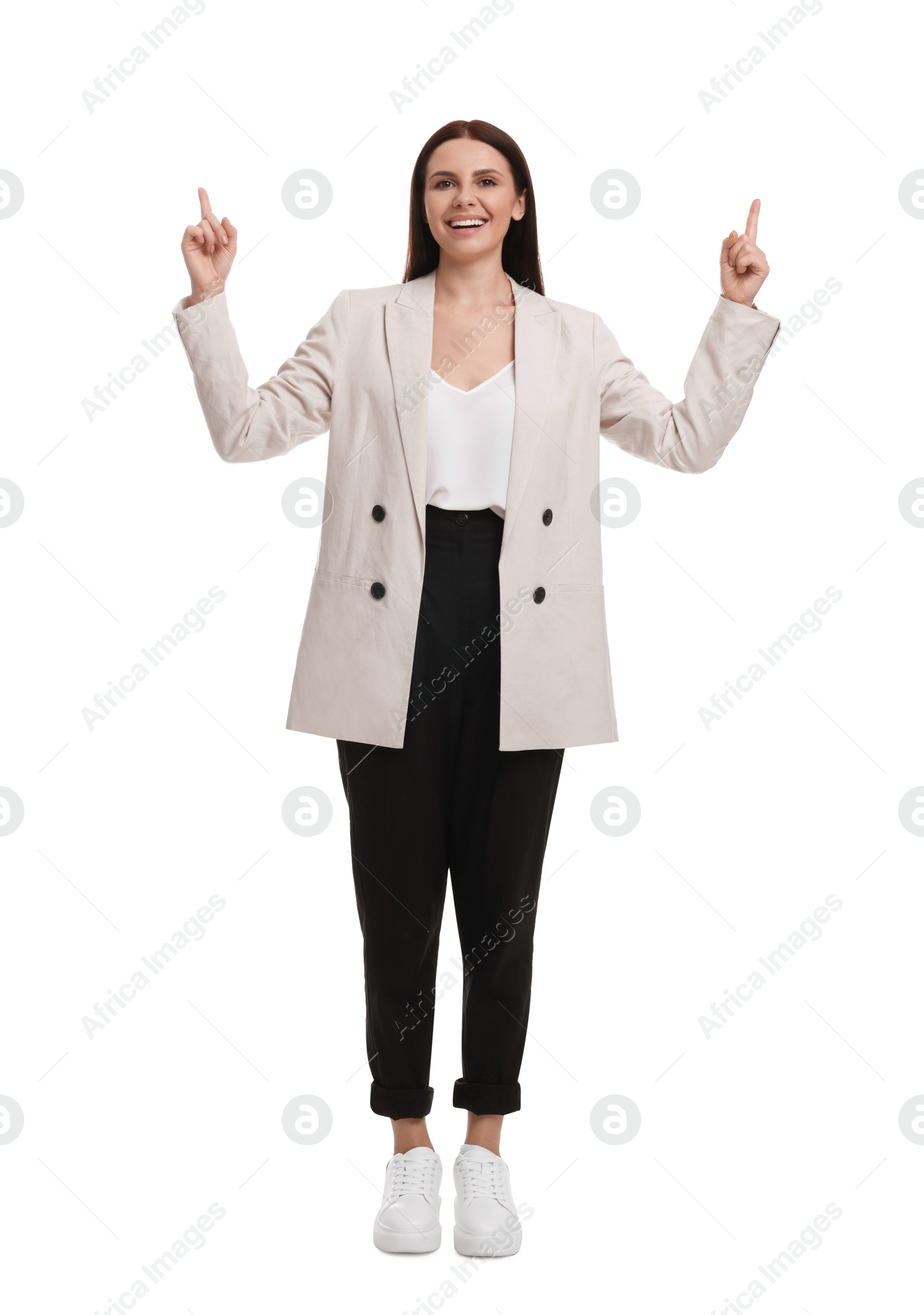 Photo of Beautiful businesswoman in suit pointing at something on white background