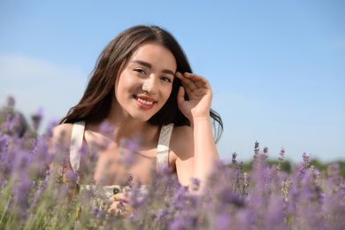 Young woman in lavender field on summer day