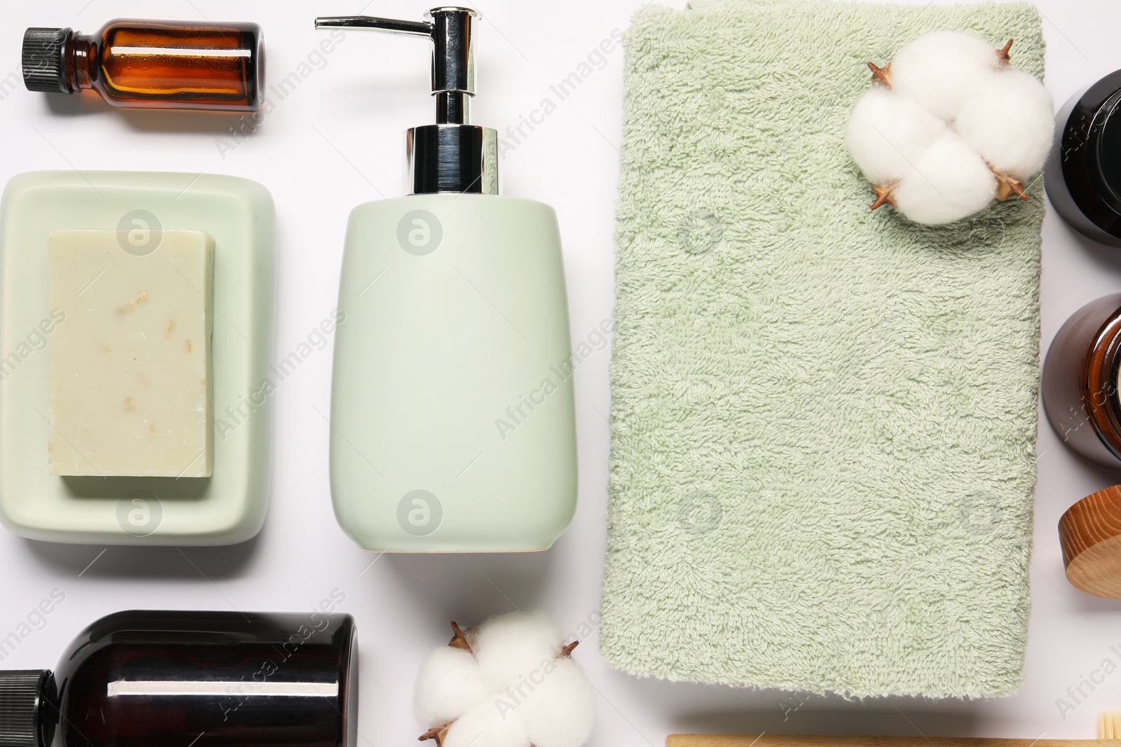 Photo of Bath accessories. Different personal care products and cotton flowers on white background, flat lay