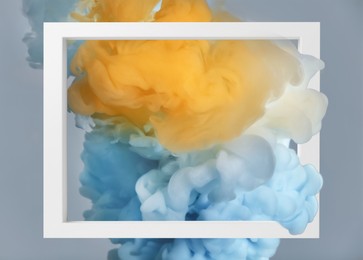 Image of Splashes of colorful ink and frame on grey background