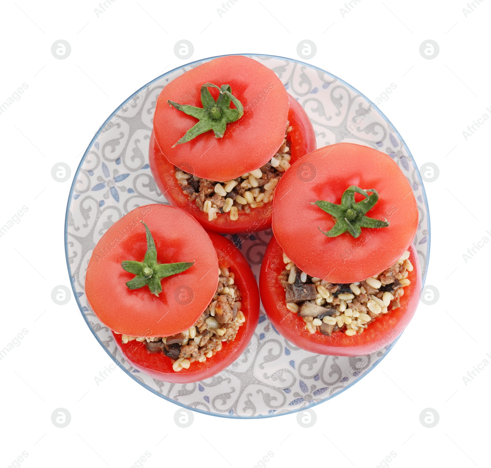 Photo of Delicious stuffed tomatoes with minced beef, bulgur and mushrooms isolated on white, top view