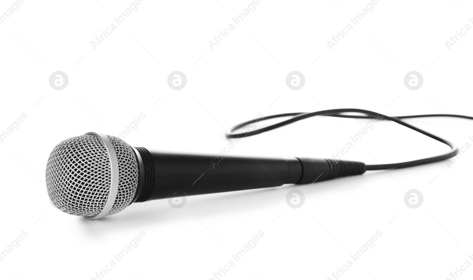 Photo of Professional dynamic microphone with wire on white background