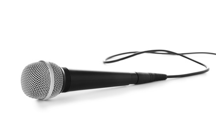 Photo of Professional dynamic microphone with wire on white background