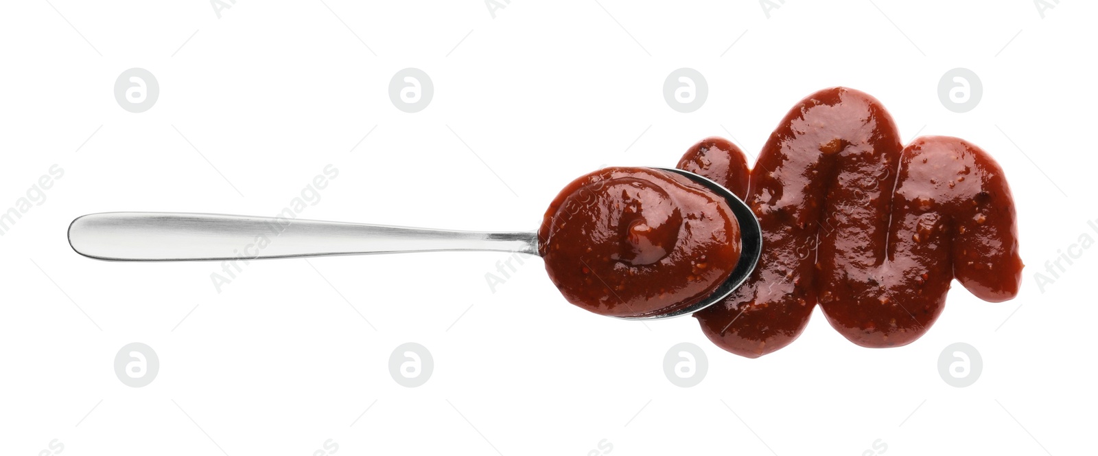 Photo of Tasty barbecue sauce and spoon isolated on white, top view