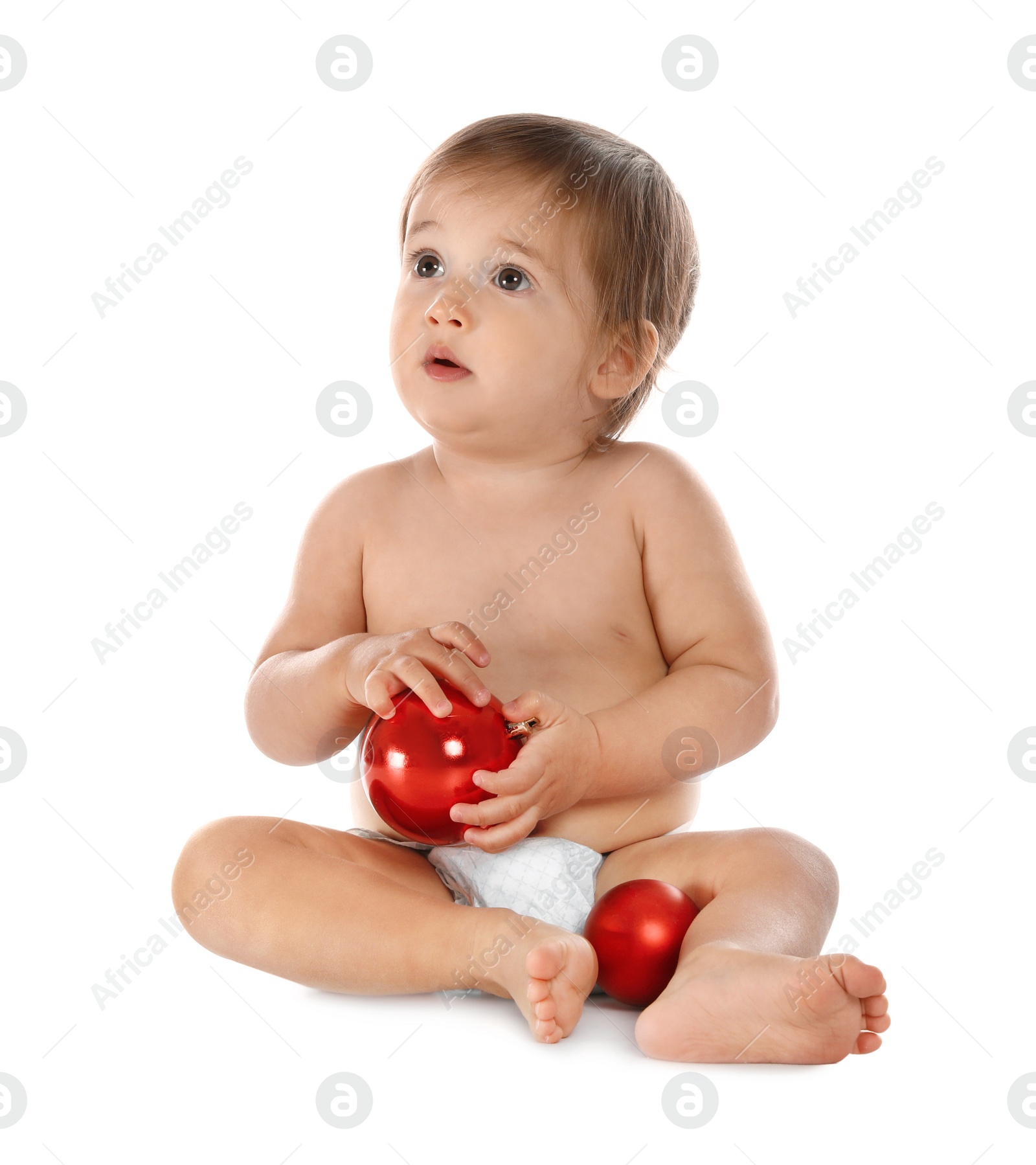 Photo of Cute little baby with Christmas decorations on white background