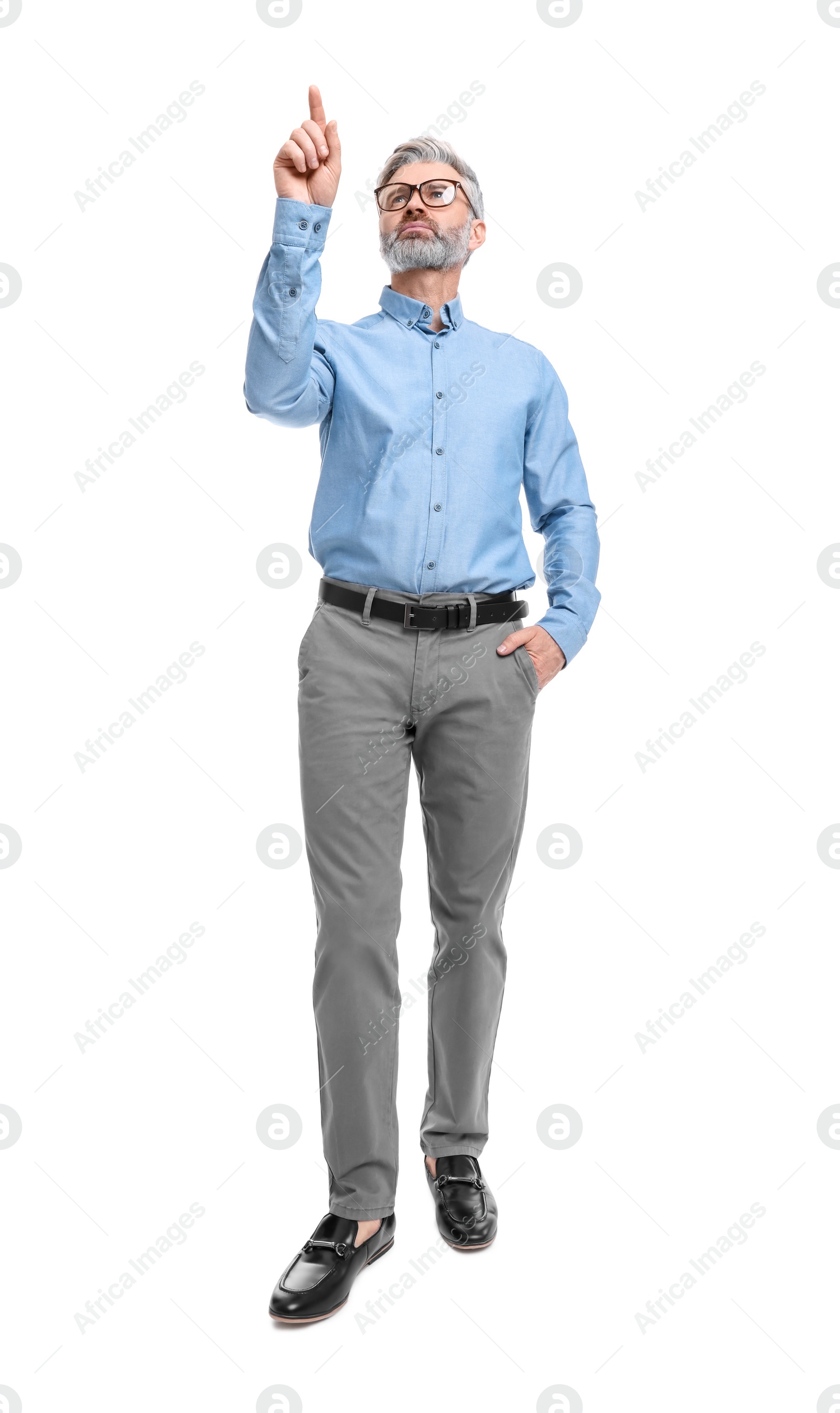 Photo of Mature businessman in stylish clothes posing on white background