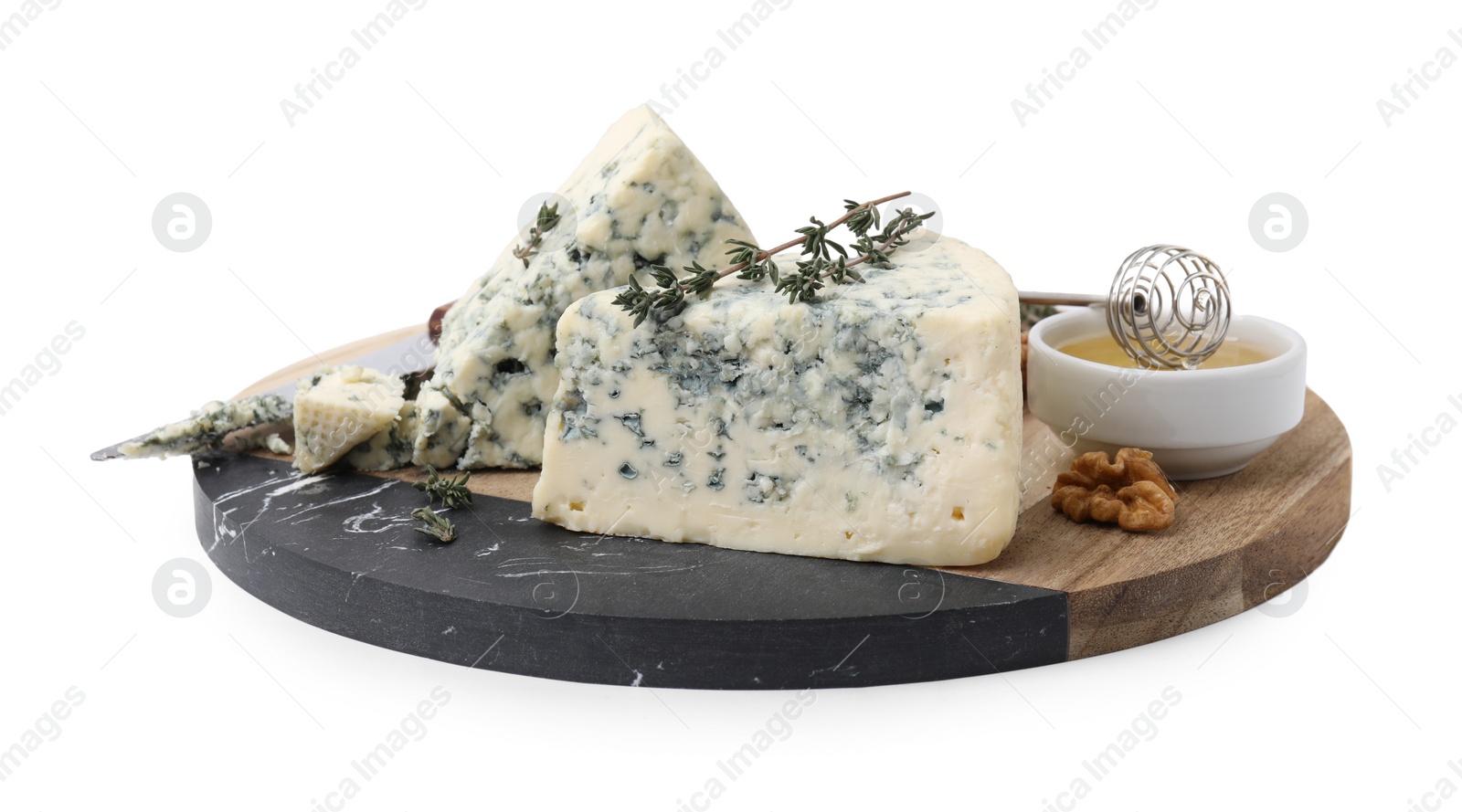 Photo of Serving board with tasty blue cheese, thyme, honey and walnuts isolated on white