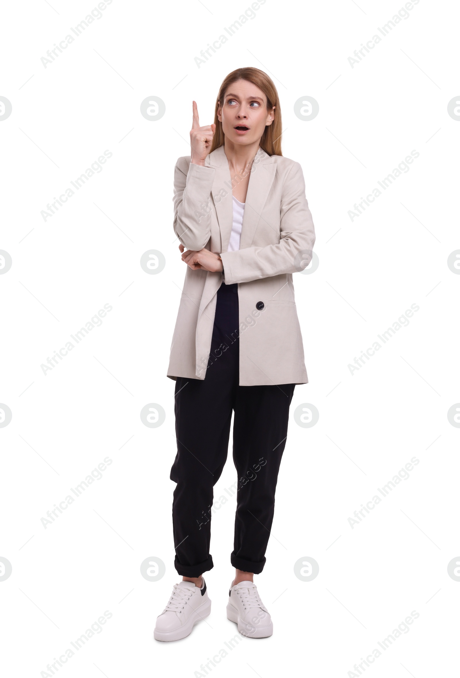 Photo of Beautiful business woman pointing at something on white background