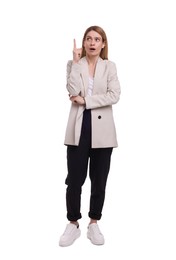 Photo of Beautiful business woman pointing at something on white background