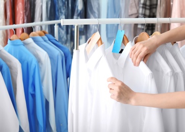 Employee working at dry-cleaner's