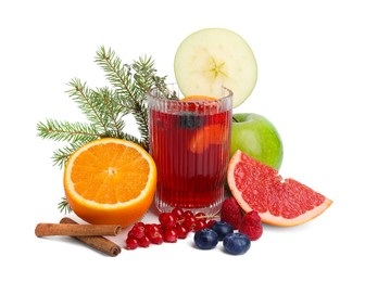 Photo of Aromatic Christmas Sangria in glass, different products and fir branches isolated on white