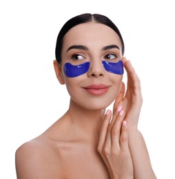 Photo of Beautiful young woman with under eye patches on white background